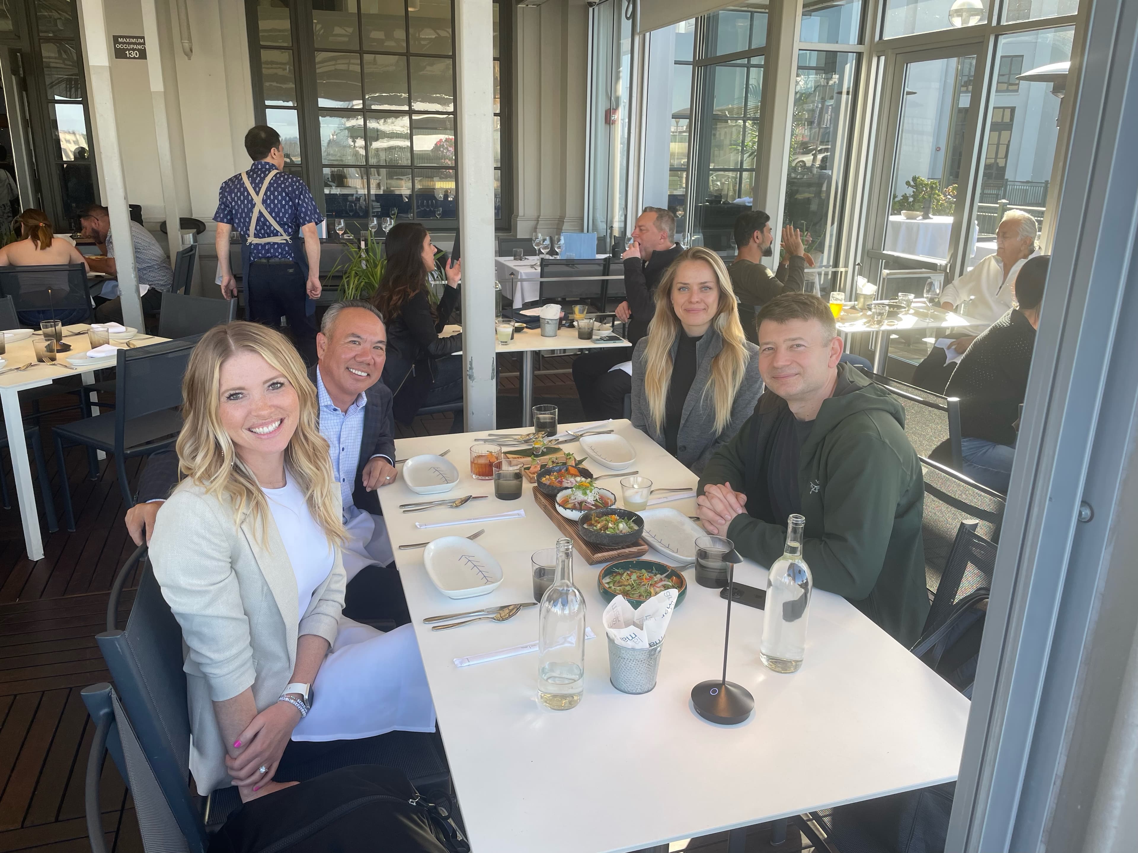 Dr. Michael Njo with board colleagues during a daytime strategy meeting focused on leadership and the future of dentistry.