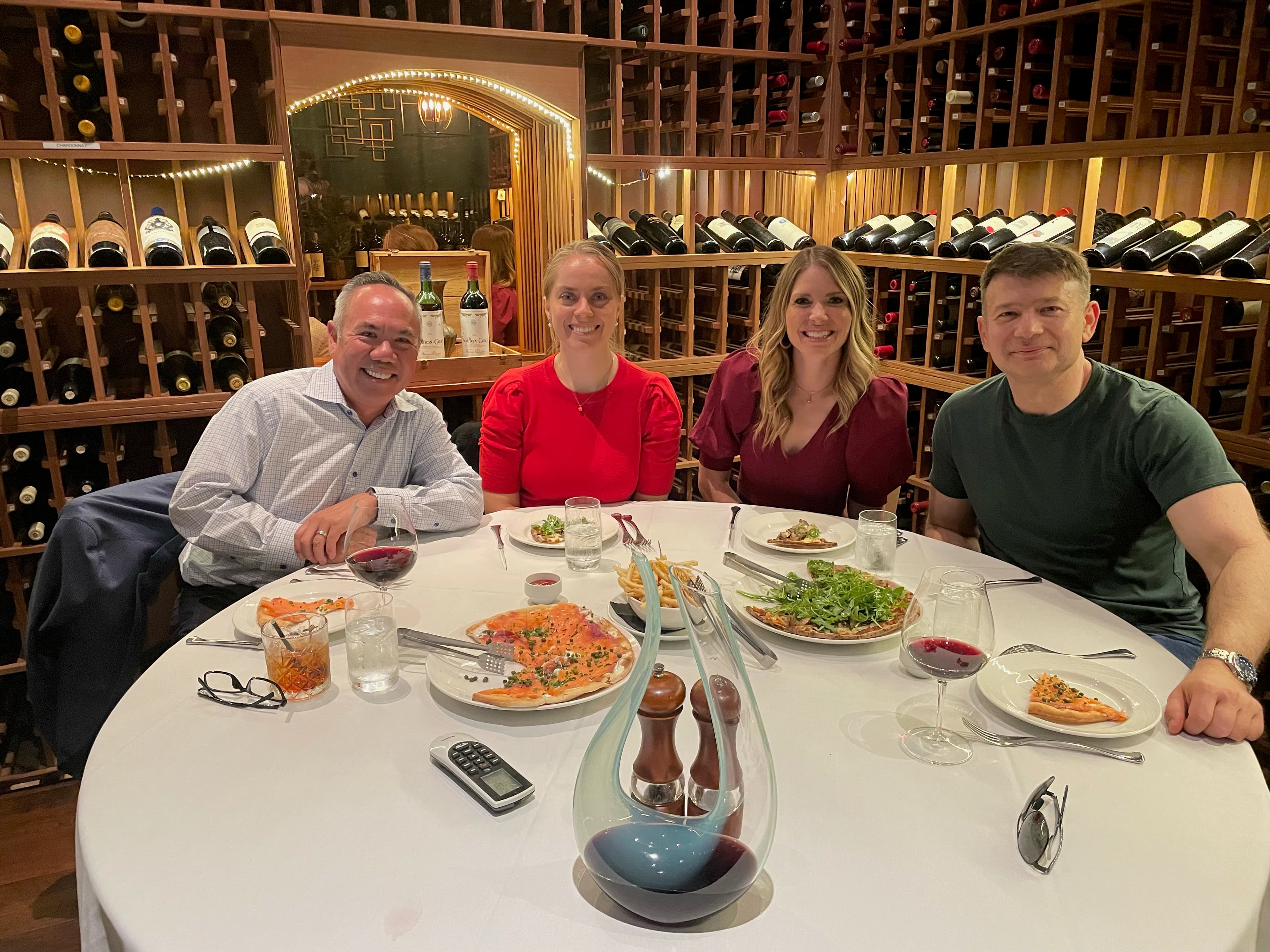 Dr. Michael Njo with board colleagues at an evening strategy dinner discussing upcoming opportunities in dentistry.
