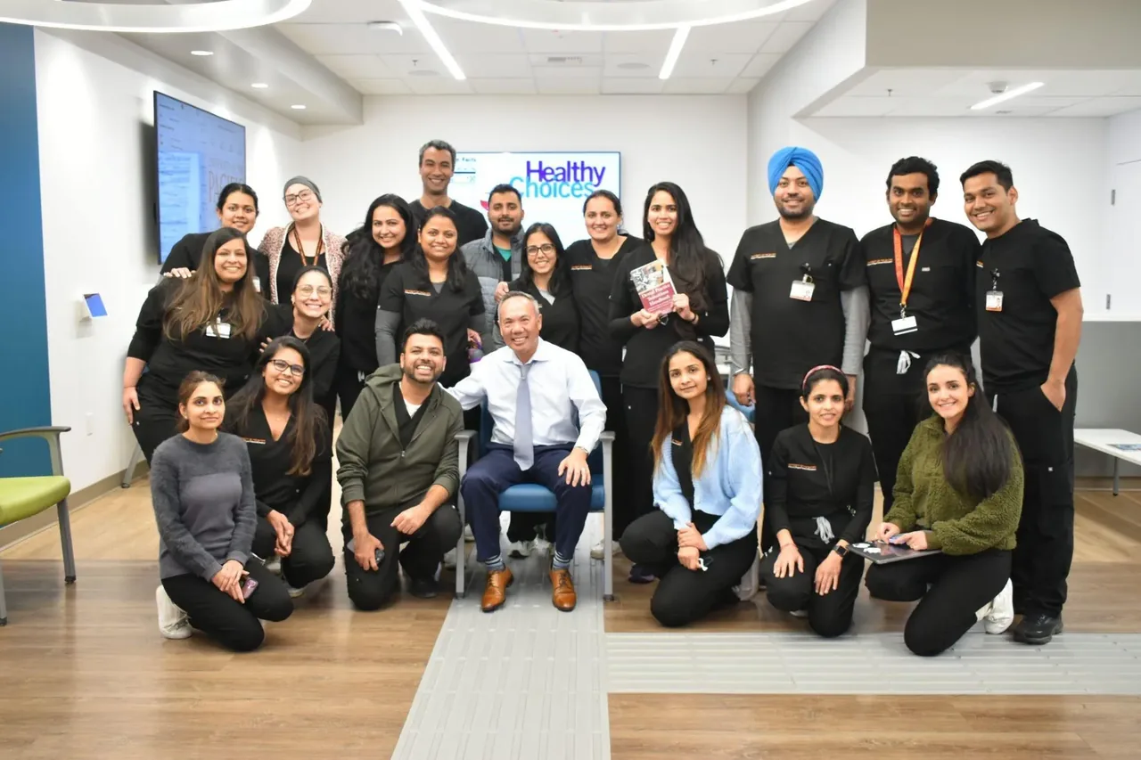 Michael Njo, DDS with dental professionals at a consulting workshop